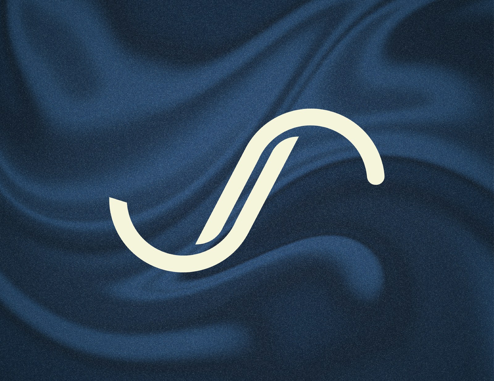 Justsudz S monogram on navy fabric texture
