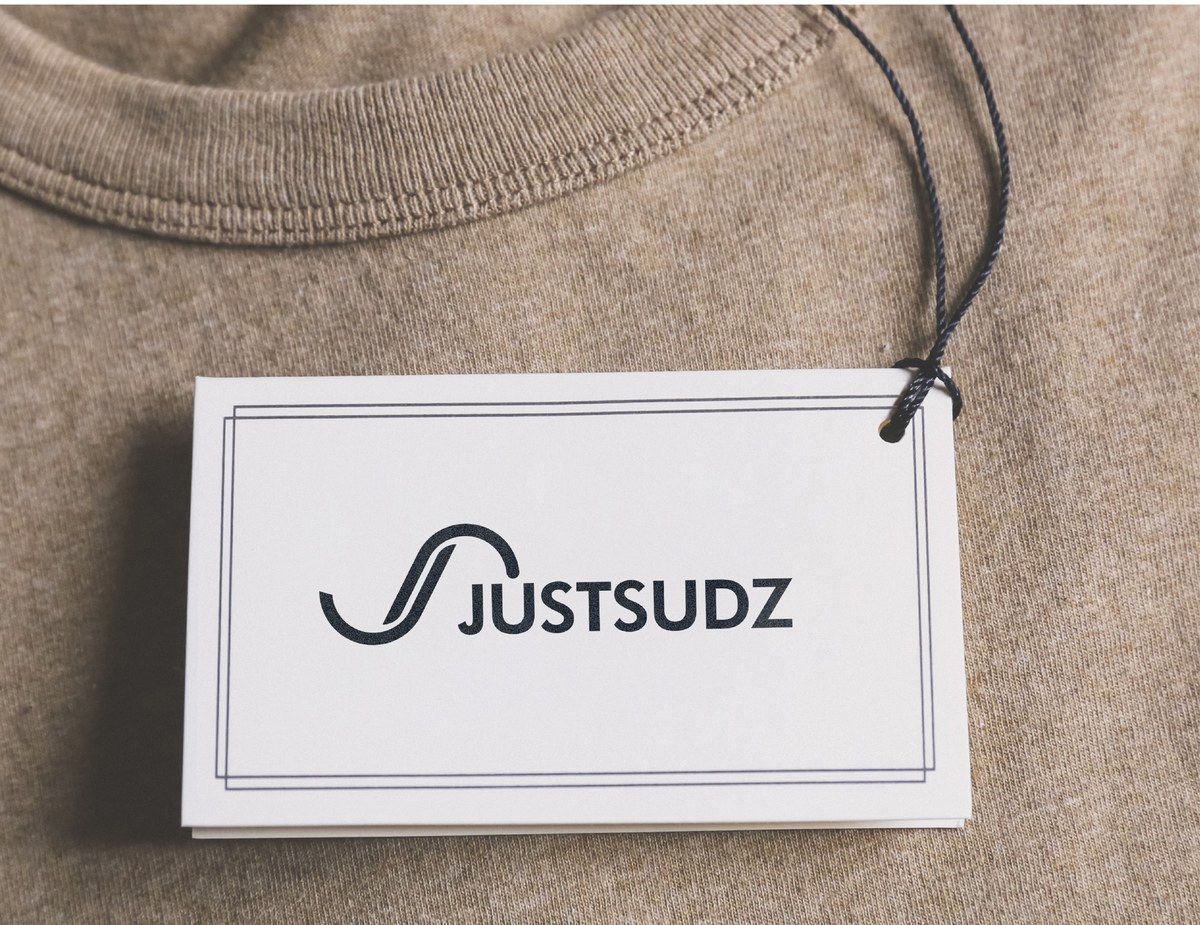 Justsudz logo on a clothing hang tag