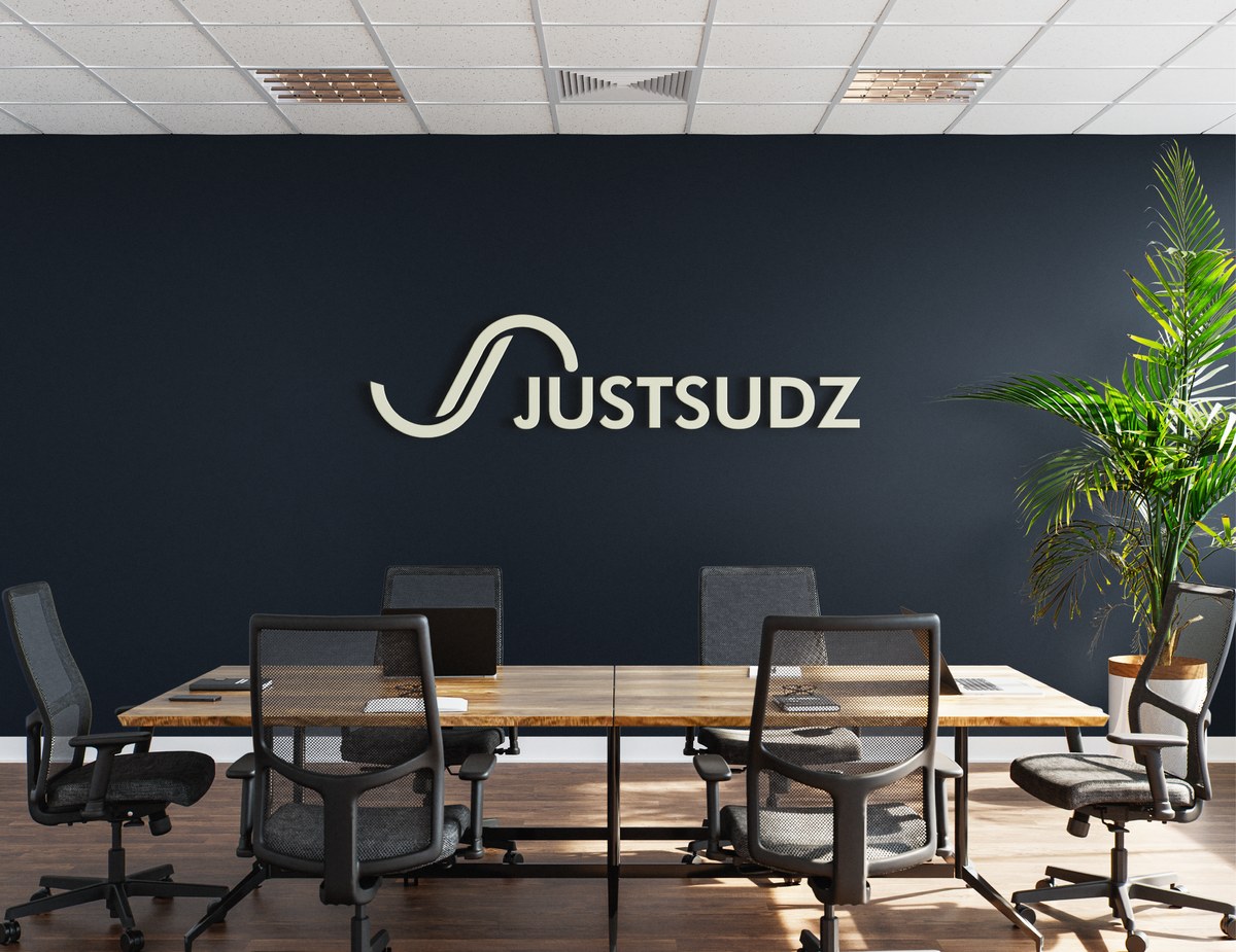 Justsudz logo on an office wall, in-store lifestyle shot
